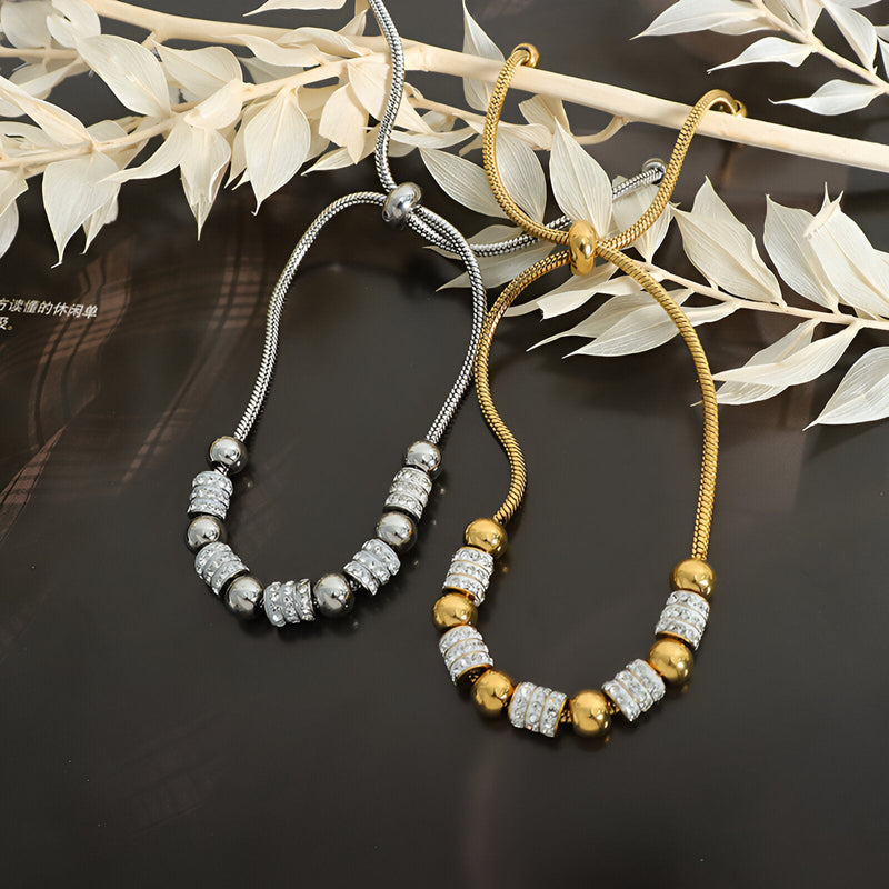 Bracelet en titane plaqué or avec perles dorées et pierres de cristal, modèle Nancy, variante or et argent.