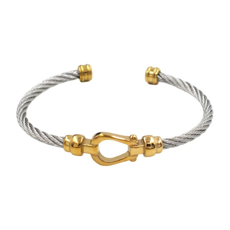 Bracelet jonc ouvert en acier inoxydable torsadé argent avec fer à cheval doré aux extrémités.