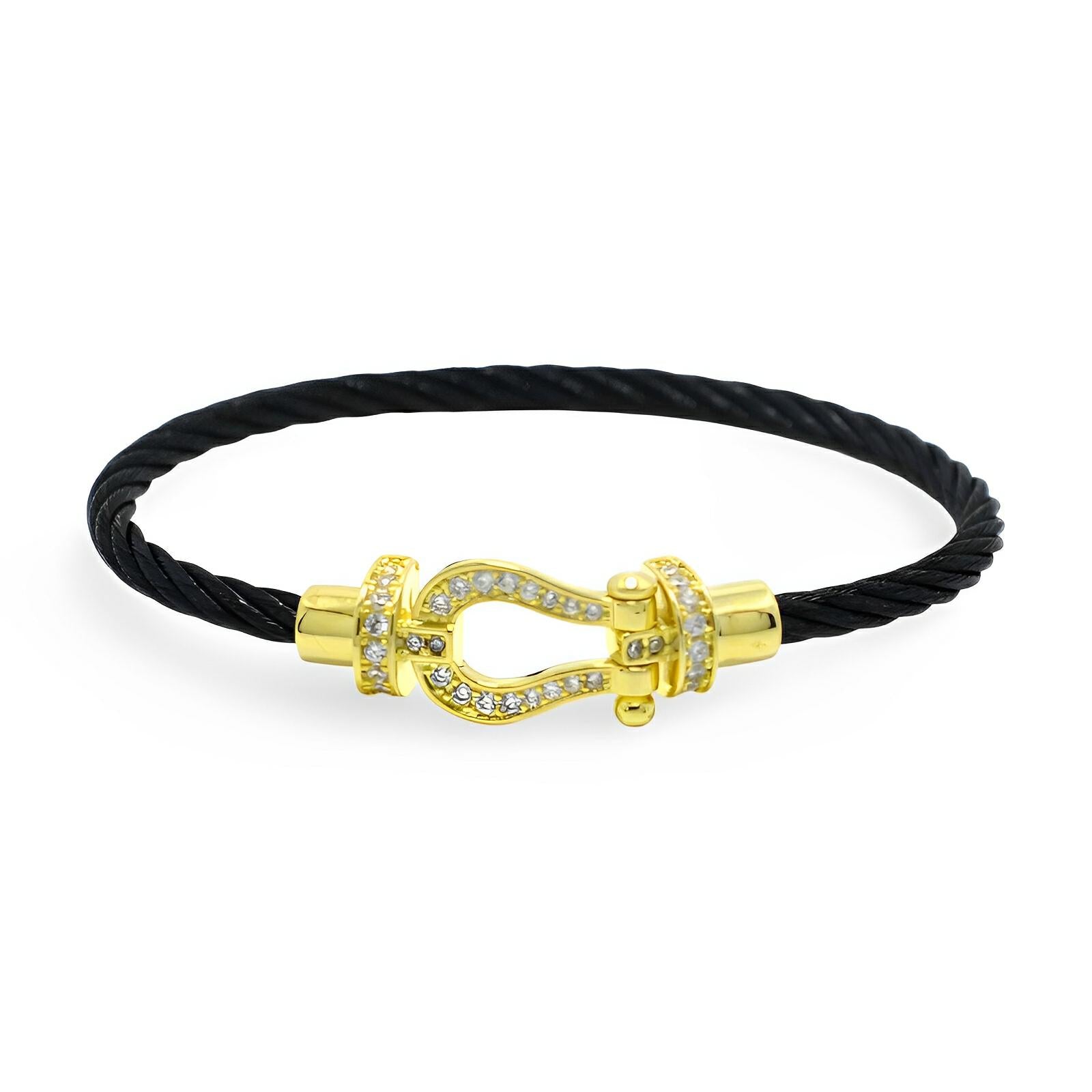 Bracelet femme cordon noir titane fermoir fer à cheval or doré et strass blancs.