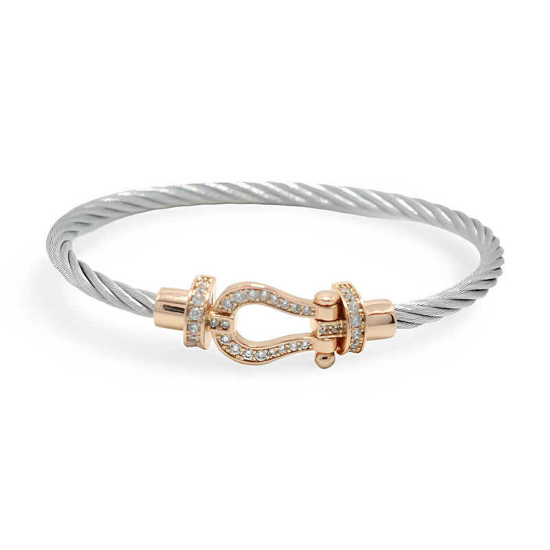 Bracelet fer à cheval en titane argenté avec fermoir or rosé serti de cristaux, modèle Annabelle.
