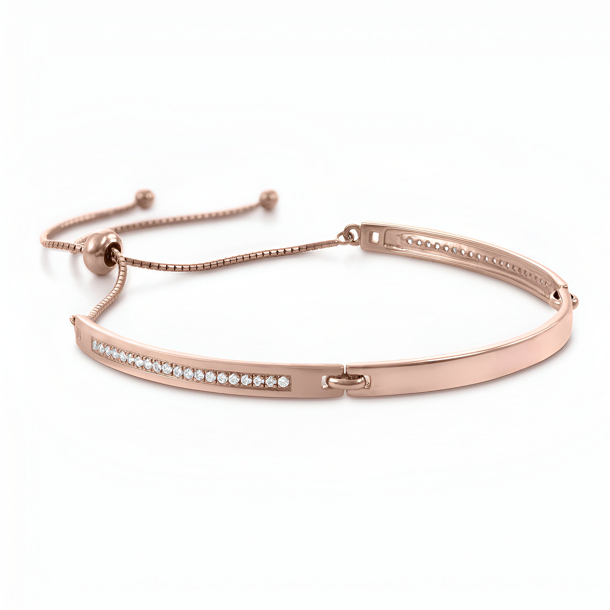 Bracelet gourmette ajustable en or rosé avec rangée d'oxydes de zirconium scintillants.