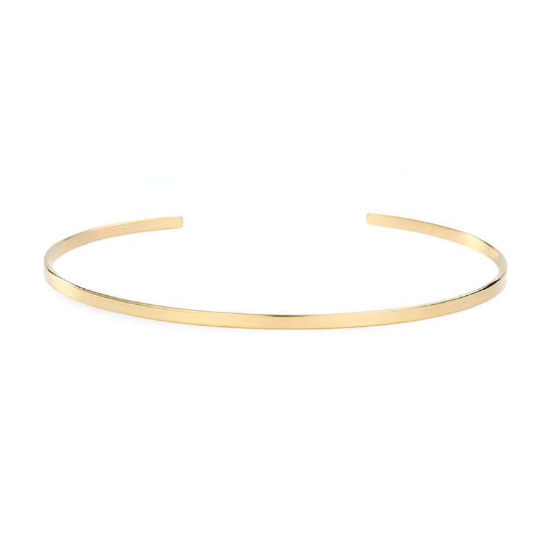 Bracelet jonc fin en acier inoxydable couleur or, finition lisse et brillante.