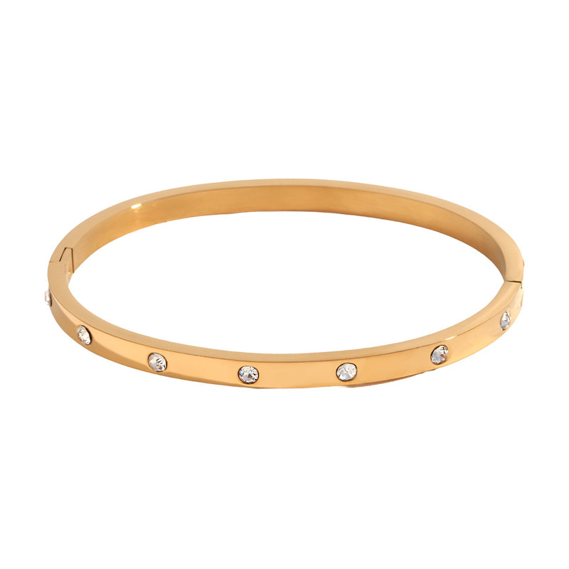 Bracelet jonc en acier inoxydable or, avec éclats de lumière incrustés uniformément.