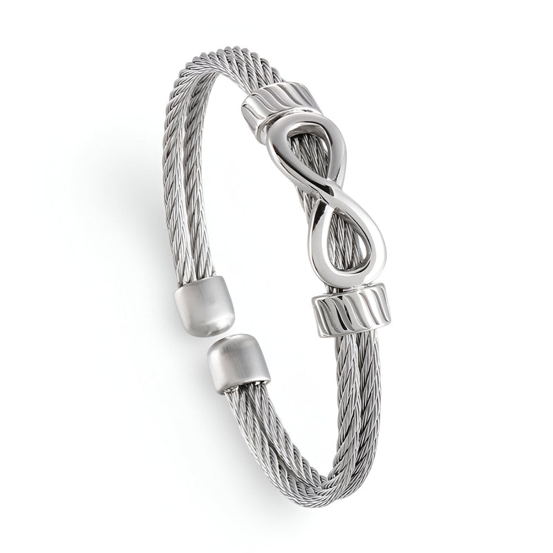 Bracelet jonc en acier inoxydable argenté à motif infini, design câble torsadé, ouverture ajustable.