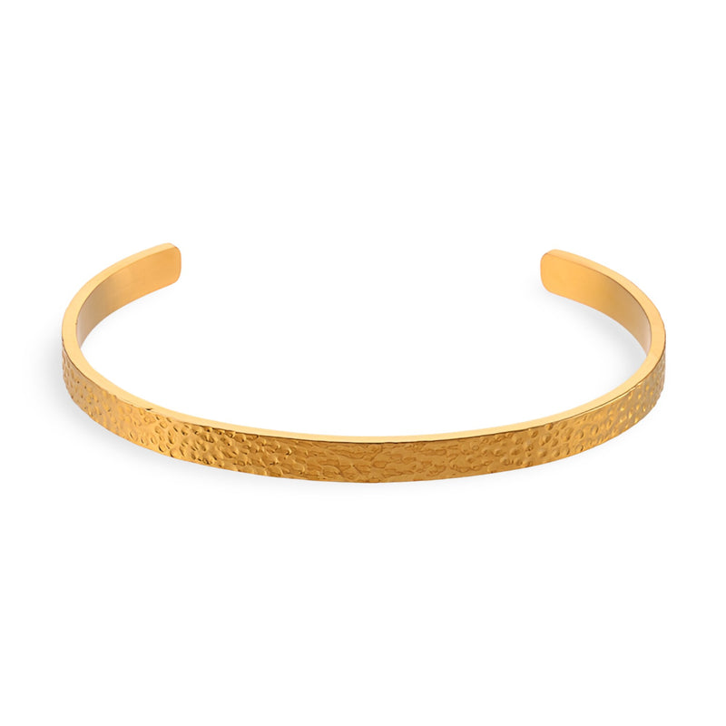 Bracelet jonc fin en acier inoxydable doré avec finition martelée, design épuré et élégant.