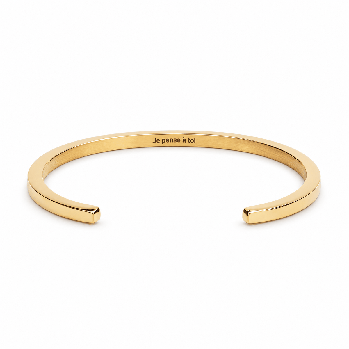 Bracelet jonc Vicky or, gravure personnalisée Je pense à toi, posé de face sur fond blanc