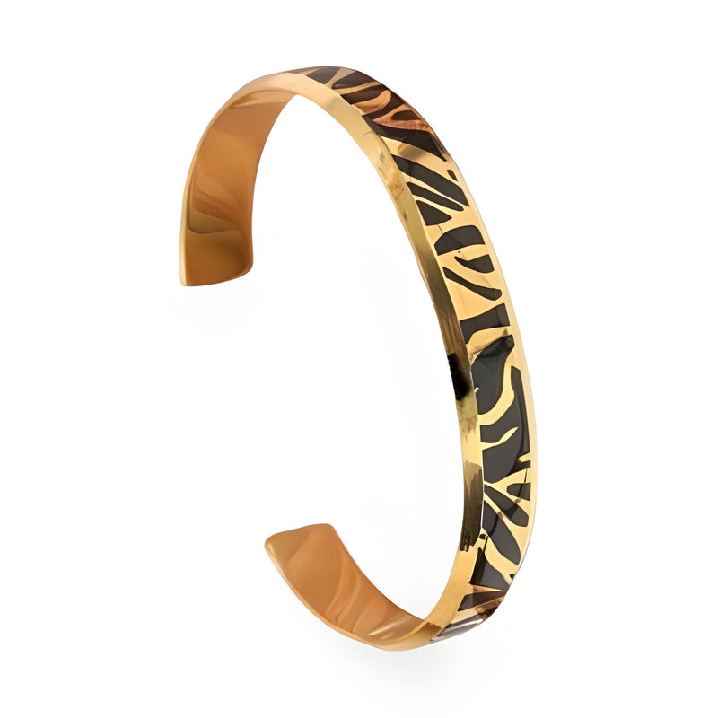 Bracelet jonc fin en titane or rosé avec motif tigré noir, intérieur lisse et brillant.