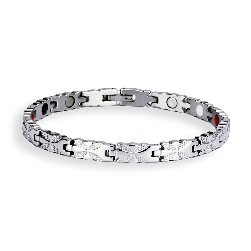 Bracelet femme magnétique en titane argenté avec maillons fins et plaques circulaires noires.