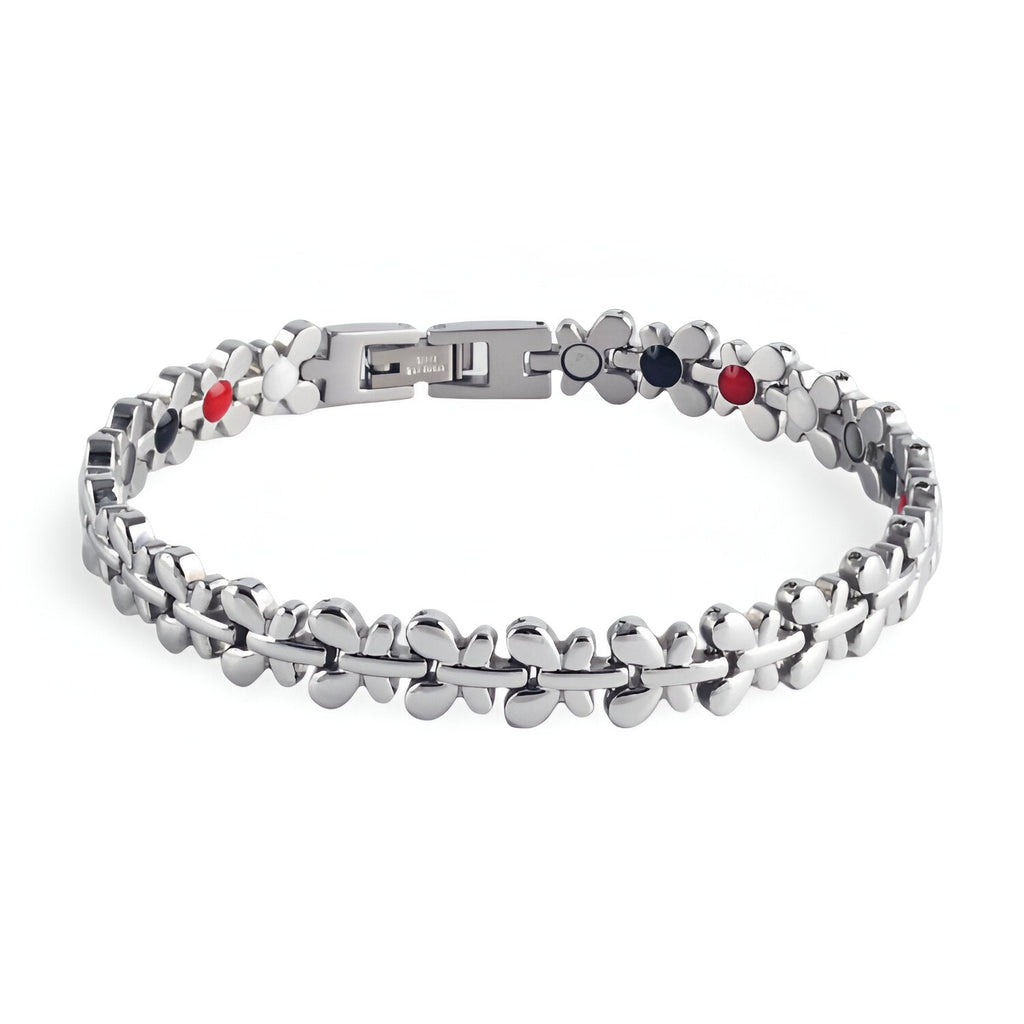 Bracelet magnétique Idunn en acier inoxydable argenté avec maillons arrondis et pastilles noires et rouges.