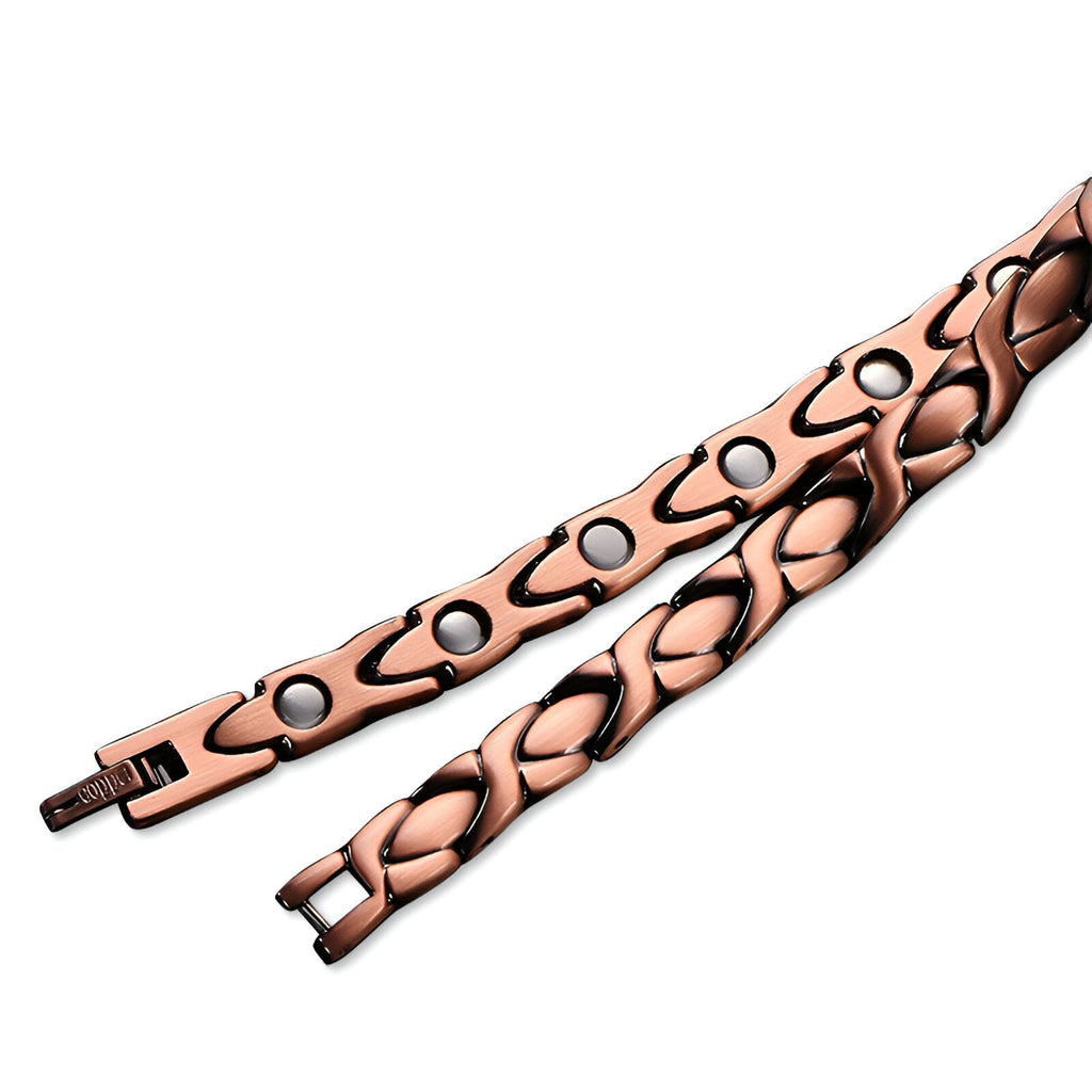 Bracelet magnétique femme en cuivre bronze avec maillons tressés et pastilles noires.
