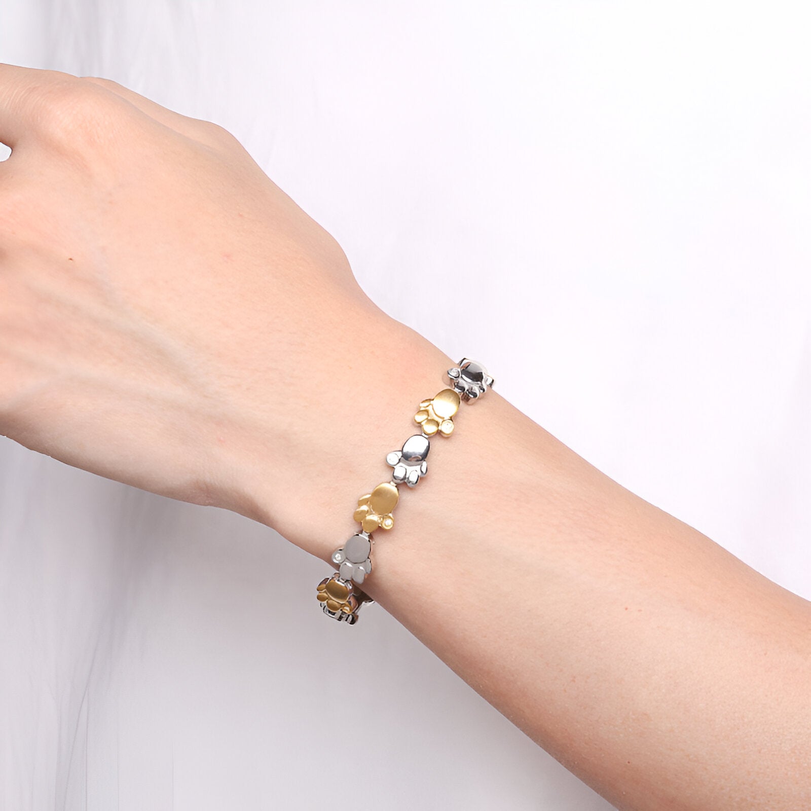 Bracelet magnétique en titane pour homme avec pattes d'animal argent et or.