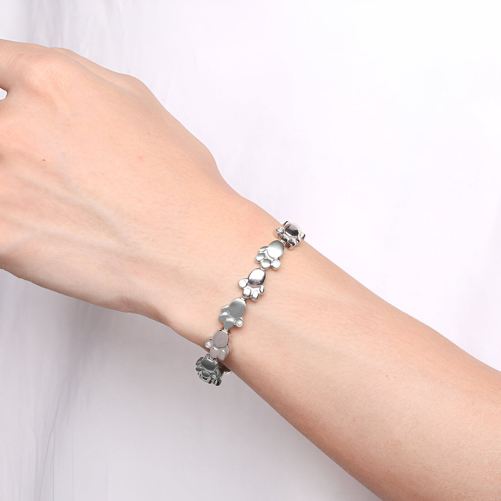 Bracelet magnétique pour homme en titane argenté avec motifs de pattes d'animal, modèle Hervor.