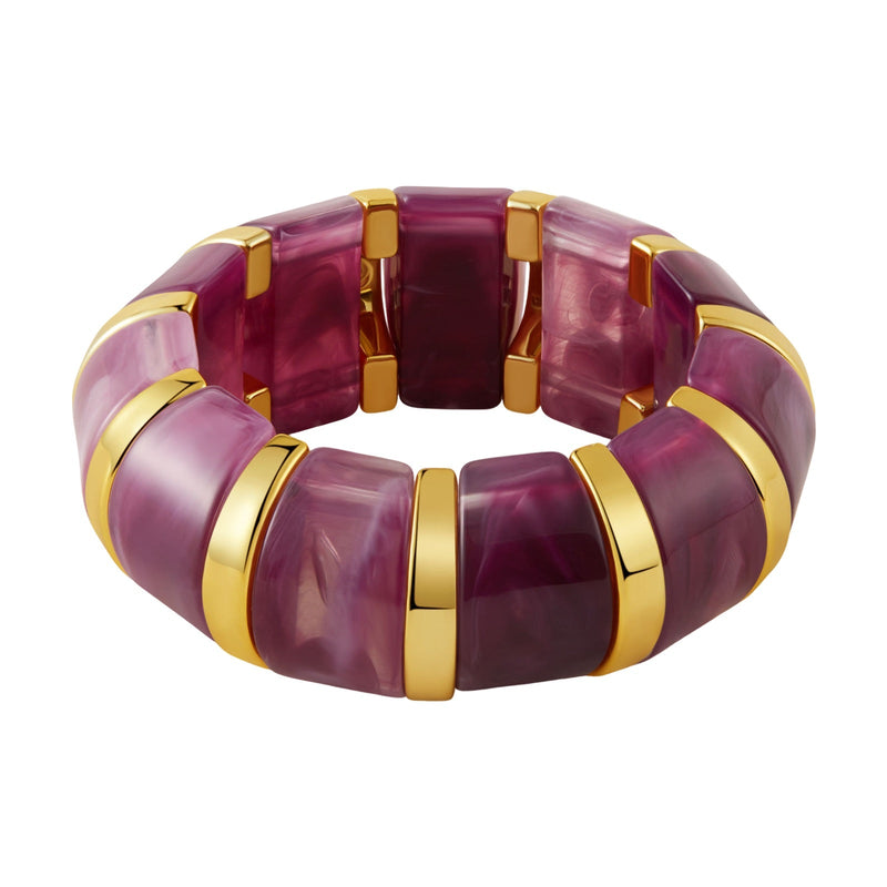Bracelet manchette épais en acrylique violet avec détails dorés, style chic et contemporain.