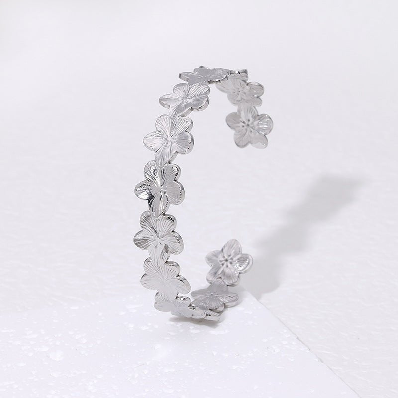 Bracelet manchette floral, fleurs scintillantes, en acier inoxydable, modèle Oraya - La Boutique du Bracelet