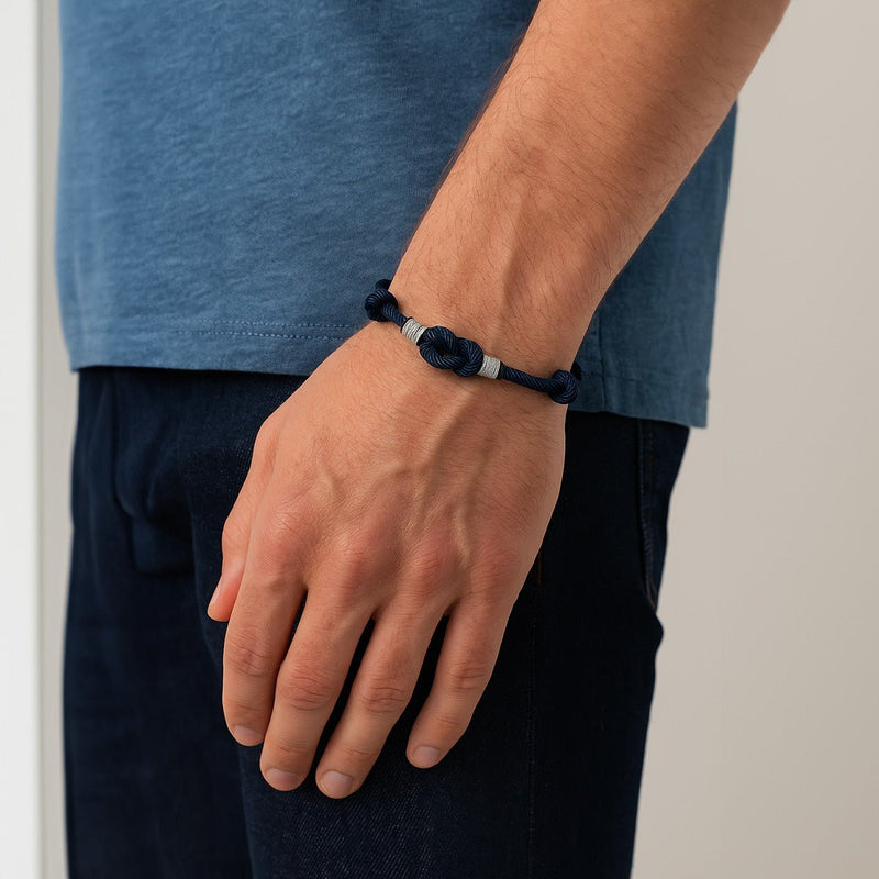 Bracelet nœud marin bleu marine en nylon avec fermeture coulissante ajustable, style Linezio.
