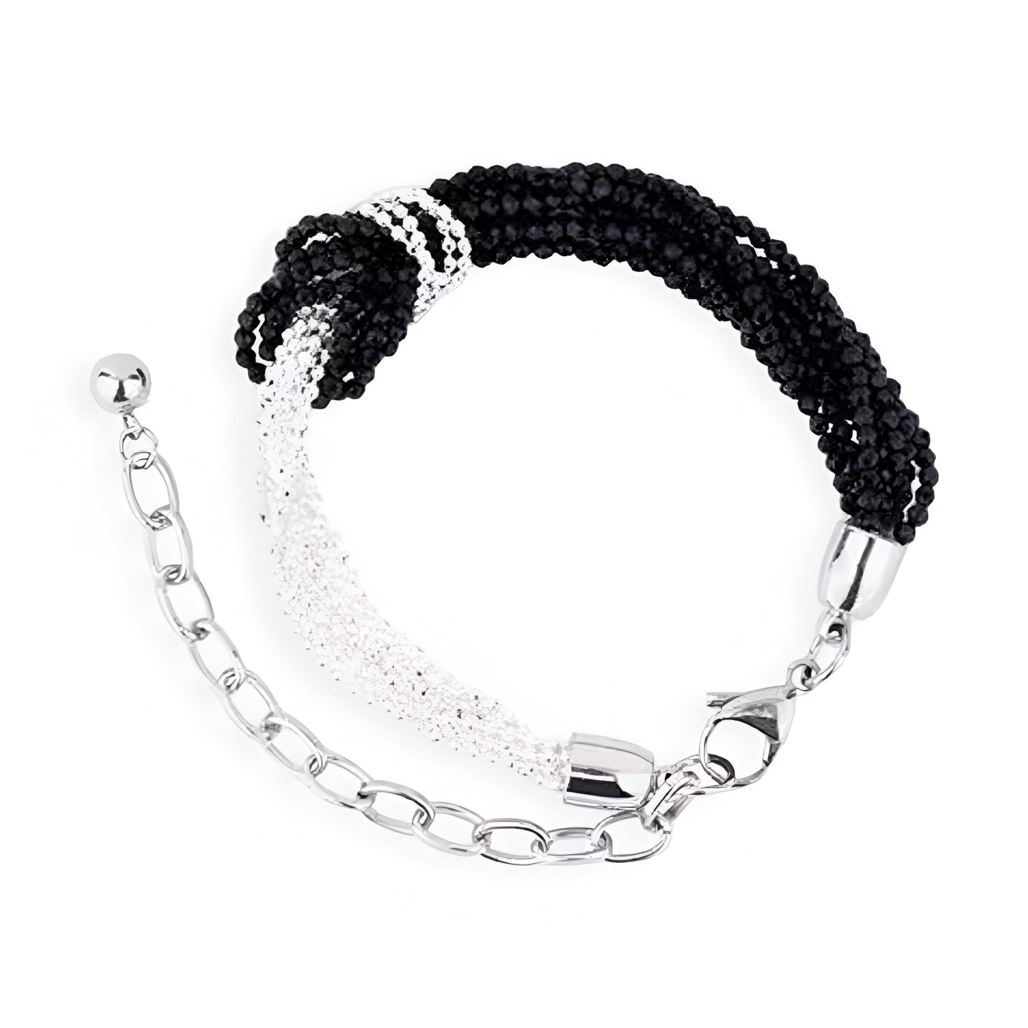 Bracelet pour femme en perles noires et blanches avec nœud central et chaîne argentée ajustable.