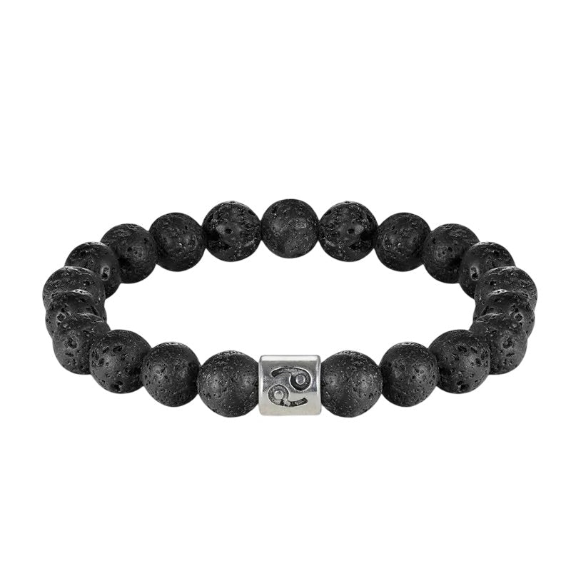 Bracelet élastique perles rondes en pierre de lave noire avec un bead métallique argenté gravé de symboles astrologiques.