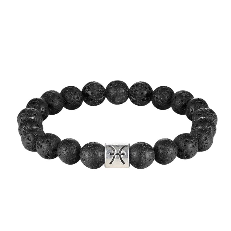Bracelet élastique en perles rondes de pierre de lave noire avec symbole astrologique Poissons en métal argenté au centre.