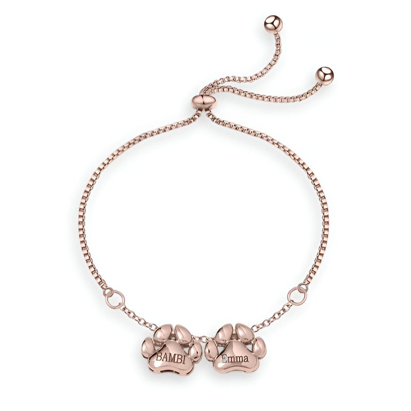 Bracelet ajustable en acier inoxydable or rosé avec deux pendentifs pattes gravés "Bambi".