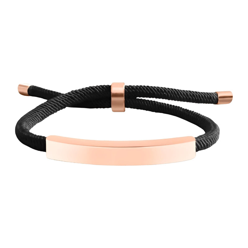 Bracelet cordon nylon noir avec barre et détails en acier inoxydable couleur rose doré, fermoir coulissant.