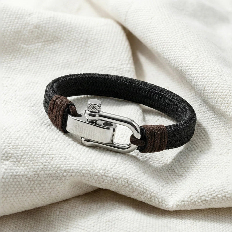 Bracelet homme tressé en coton noir avec fermoir manille en acier inoxydable argenté, style marin, ajustable.
