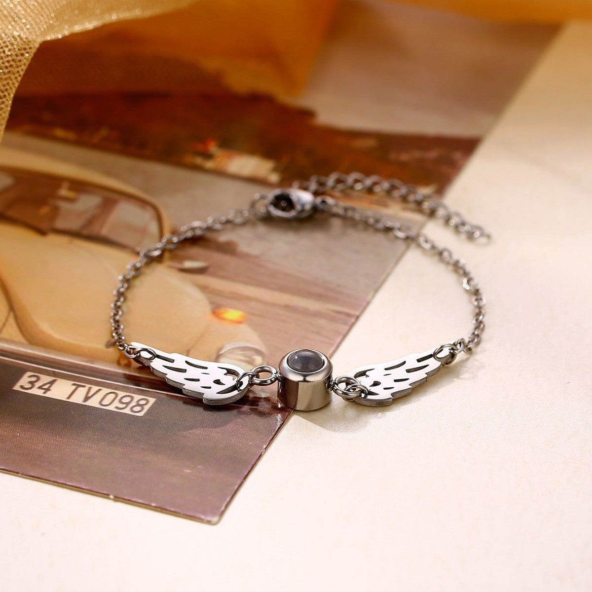 Bracelet photo projection, ailes protectrices, bijou personnalisé, acier inaltérable, cadeau émotion, modèle Flya