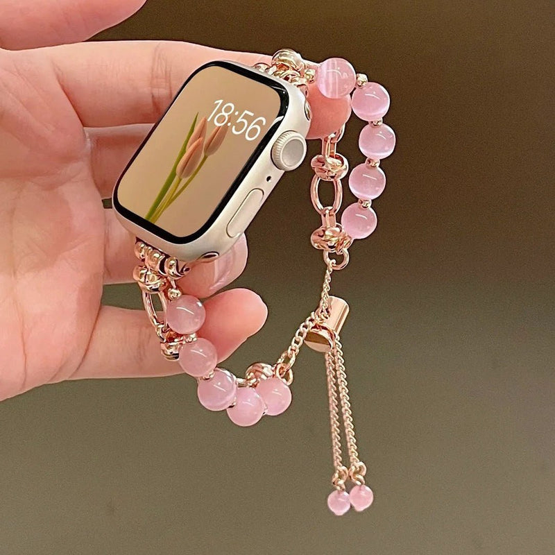 Bracelet pour Apple Watch en perles œil de chat roses avec chaîne ajustable en métal doré rose.
