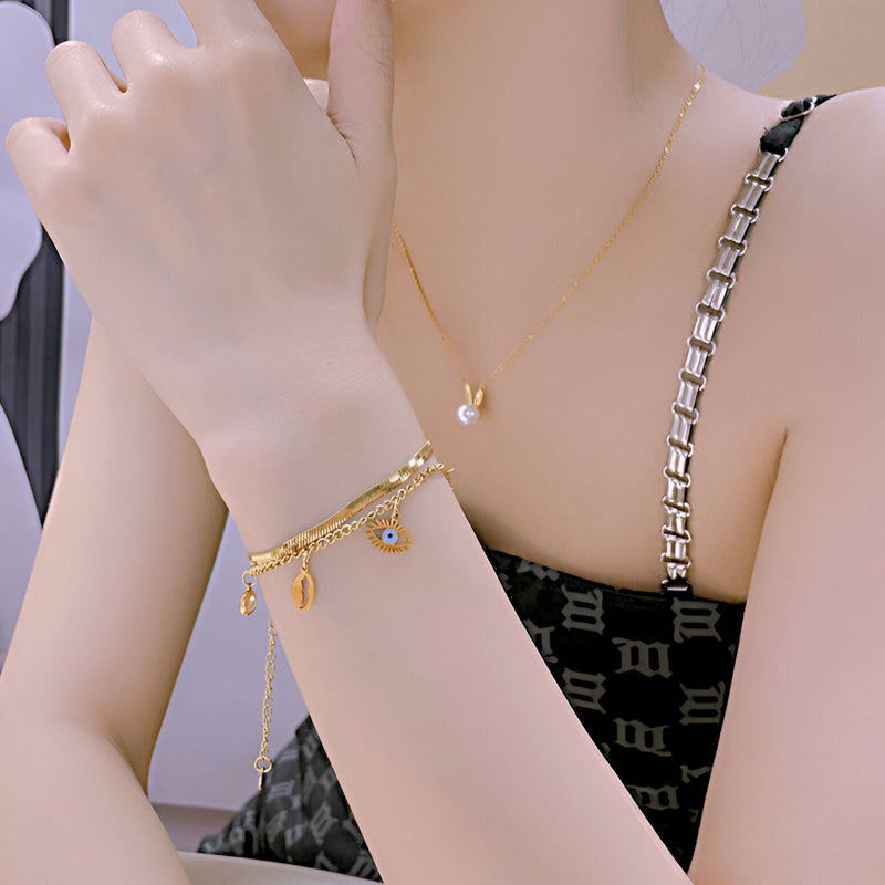 Pulsera para mujer, de acero inoxidable, con charm de ojo y estrella, modelo Clarisse