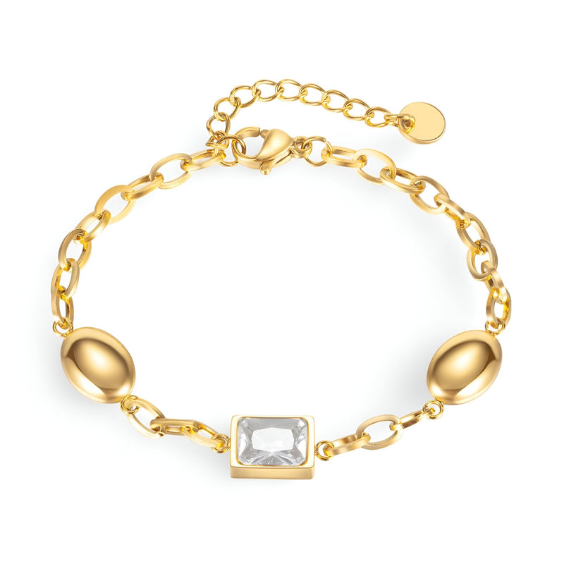 Bracelet femme or en acier inoxydable avec cube de zirconium clair et maillons ovales.