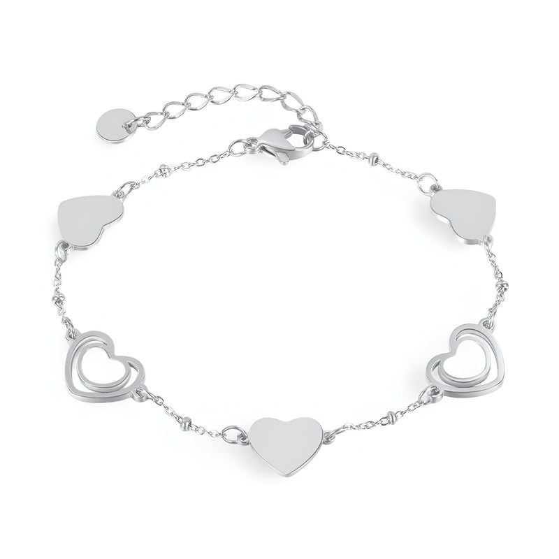 Bracelet femme en acier inoxydable argenté avec cœurs pleins et ajourés alternés, modèle Louisa.