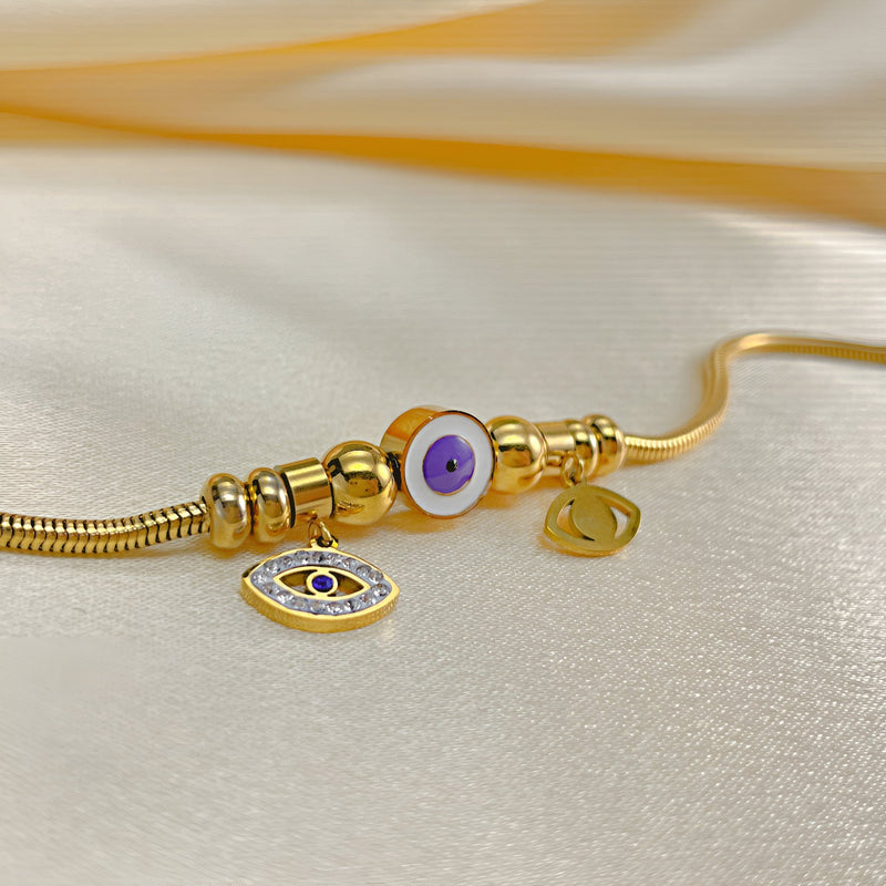 Bracelet or en acier inoxydable avec œil violet de protection et pendentif œil porte-bonheur.