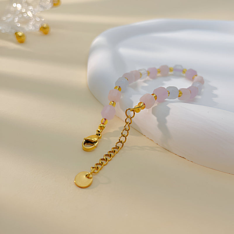 Bracelet femme en acier inoxydable or avec pierres rondes de morganite et chaîne ajustable, modèle Melita.