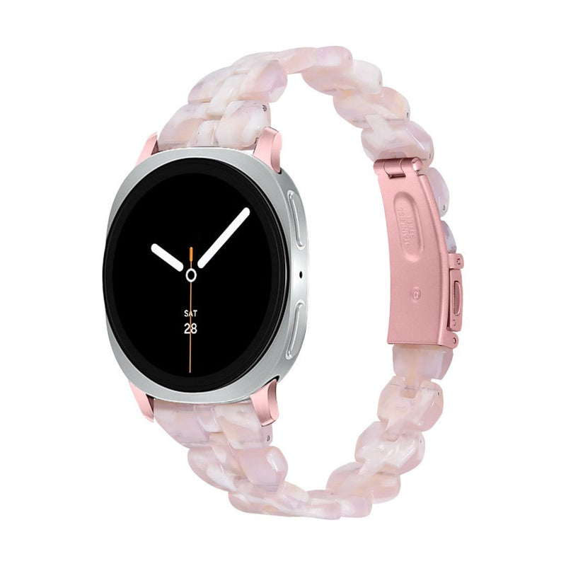 Bracelet Samsung Watch en résine rose pâle, maille épaisse chic, boucle déployante rose métallique.