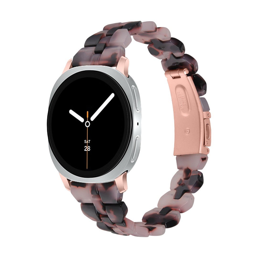 Bracelet pour Galaxy Watch en résine marron tachetée, maillons larges et boucle déployante rose métallisée.