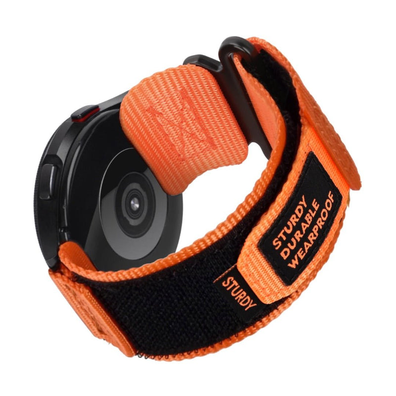 Bracelet en nylon orange et noir avec fermoir velcro robuste pour montre connectée Samsung Galaxy Watch.