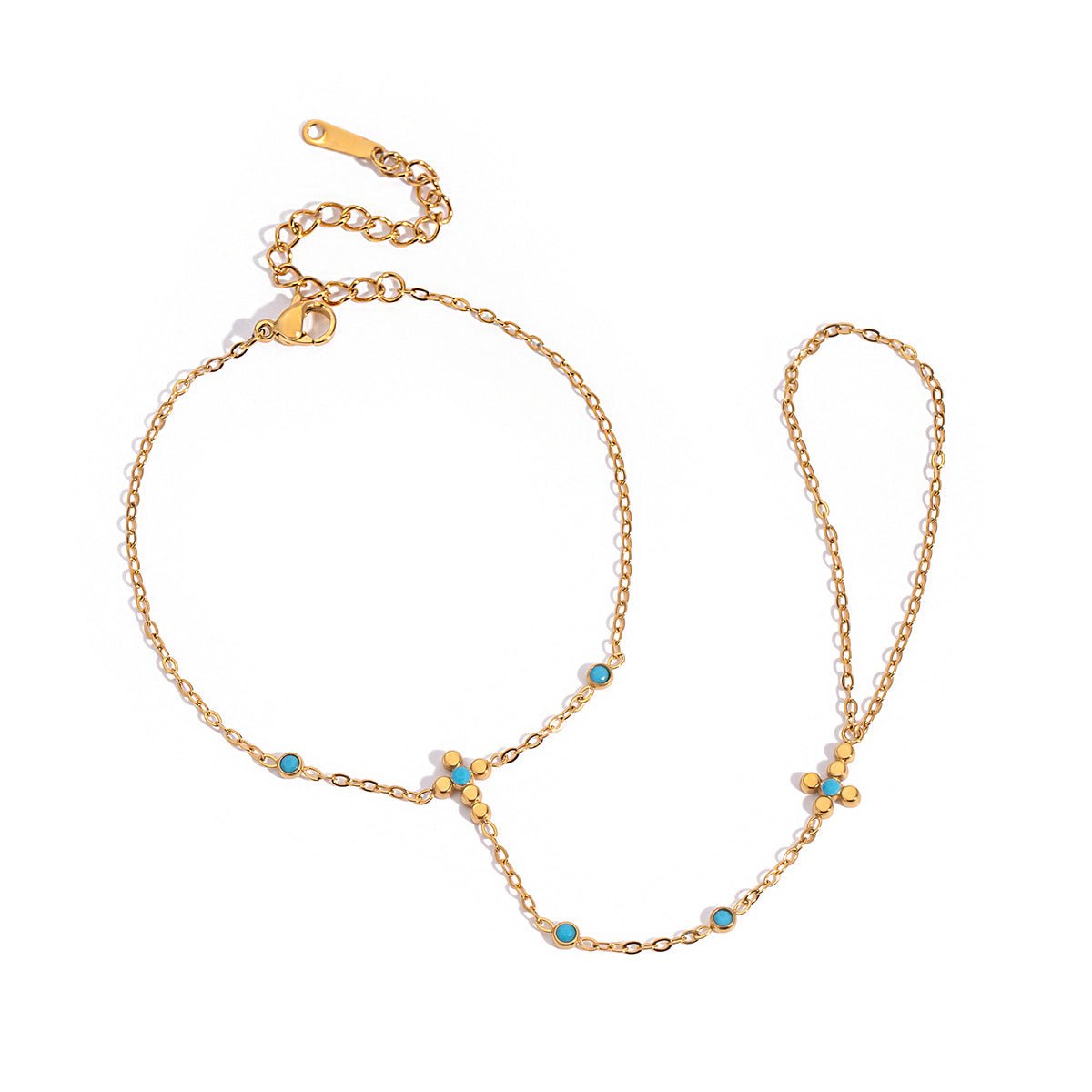 Chaîne de doigt en acier inoxydable doré avec perles turquoise et petite croix chrétienne centrale.