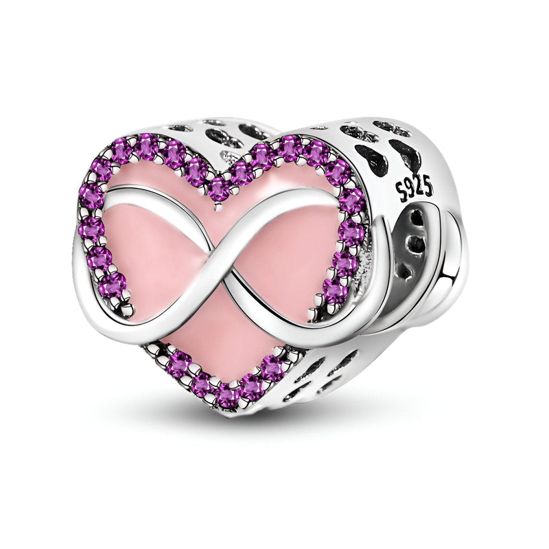 Charm cœur en argent 925 rose avec symbole infini entouré de pierres roses scintillantes.