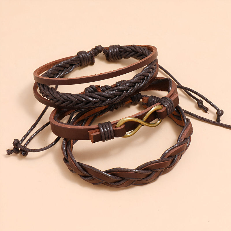 Ensemble de 3 bracelets en cuir marron avec signe infini en métal doré et tressages variés.