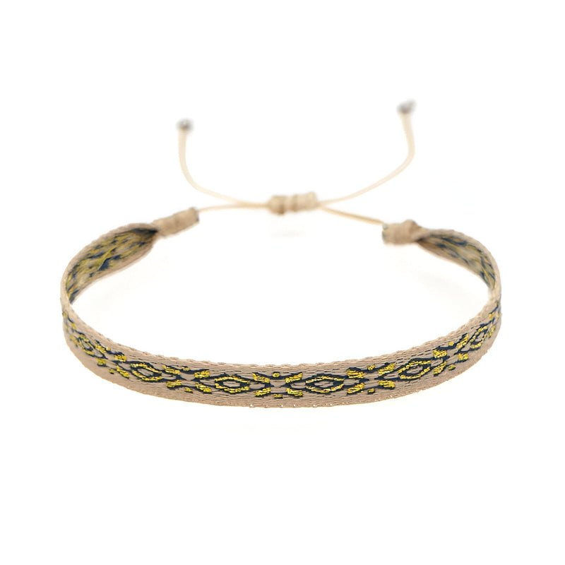 Bracelet tibétain en coton multicolore avec motif géométrique, fermeture ajustable en coton beige.