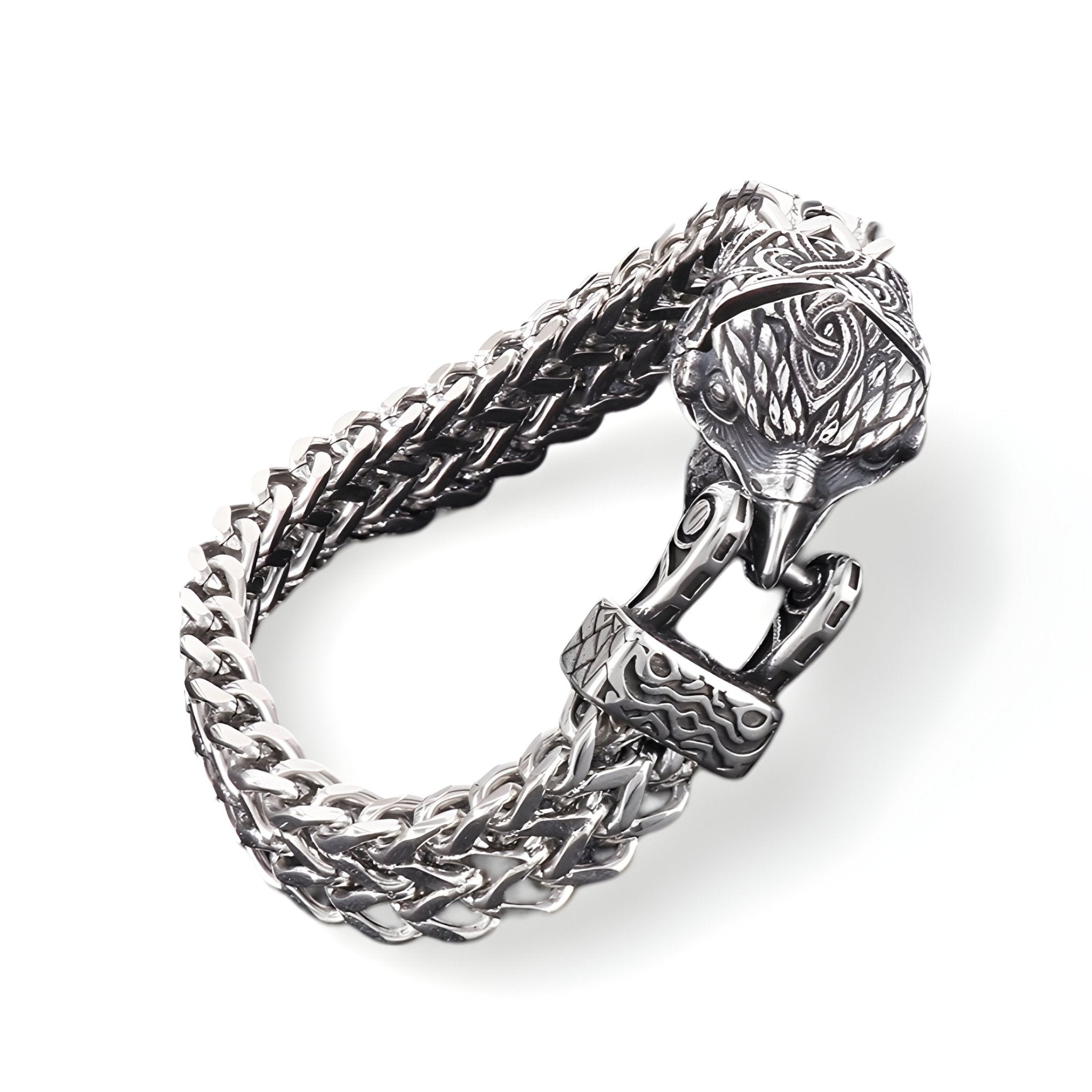 Bracelet en acier inoxydable argenté avec fermoir tête d'aigle détaillé et maillons tressés doubles.