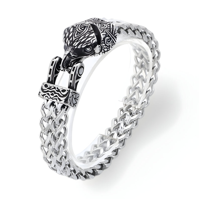 Bracelet en acier inoxydable argent avec chaîne tressée et fermoir tête d'aigle gravé noir.