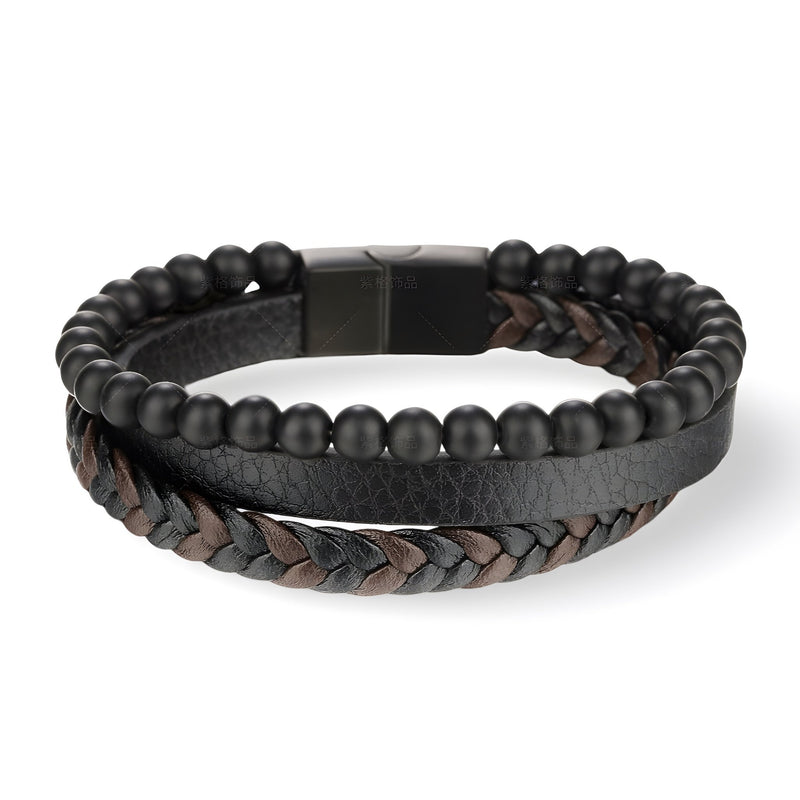 Bracelet en cuir noir et marron avec perles noires mates en pierres volcaniques et fermoir magnétique noir.