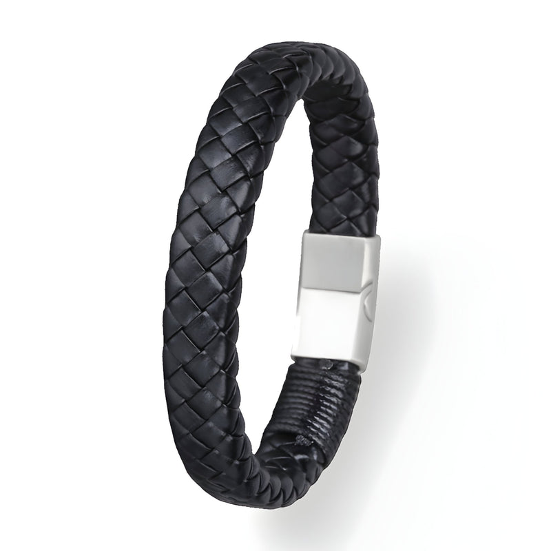 Bracelet épais en cuir noir tressé avec fermoir magnétique en acier argenté.