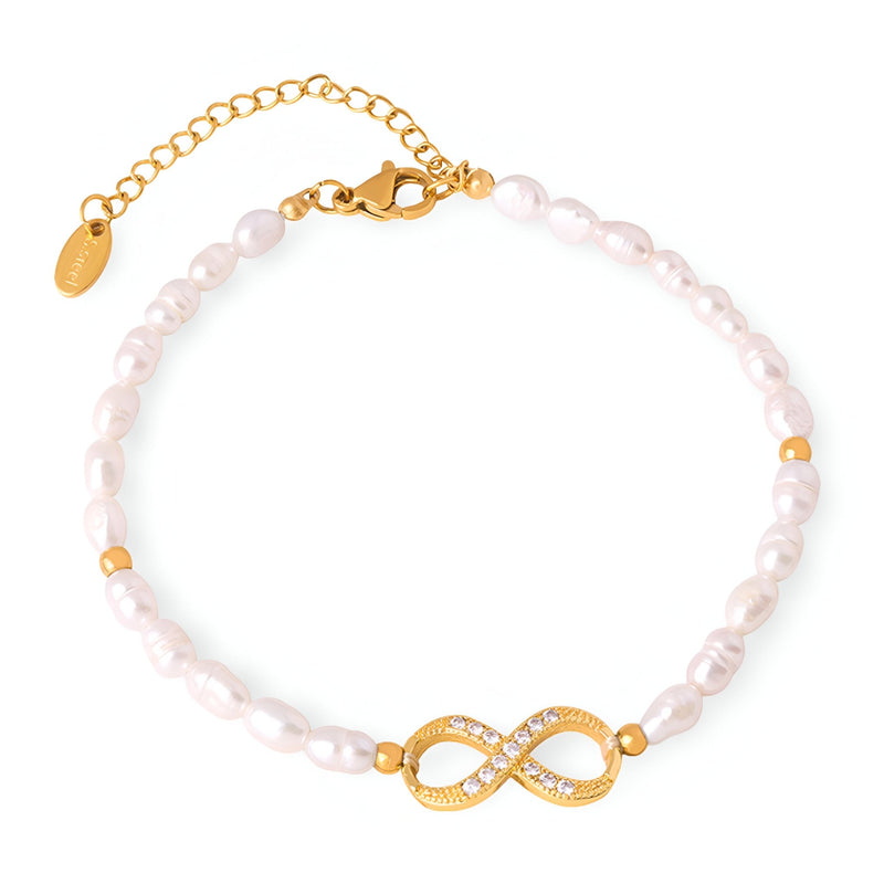 Bracelet en perles blanches avec motif infini doré serti de zircones, chaîne réglable.