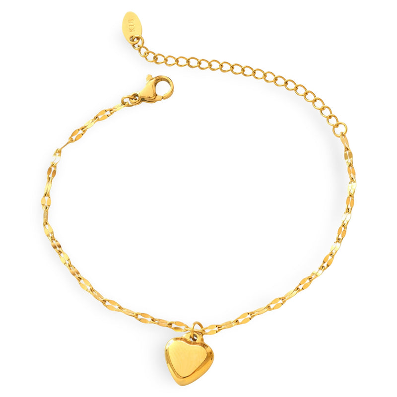 Bracelet fin en titane doré avec petit pendentif cœur lisse et chaîne délicate ajustable.