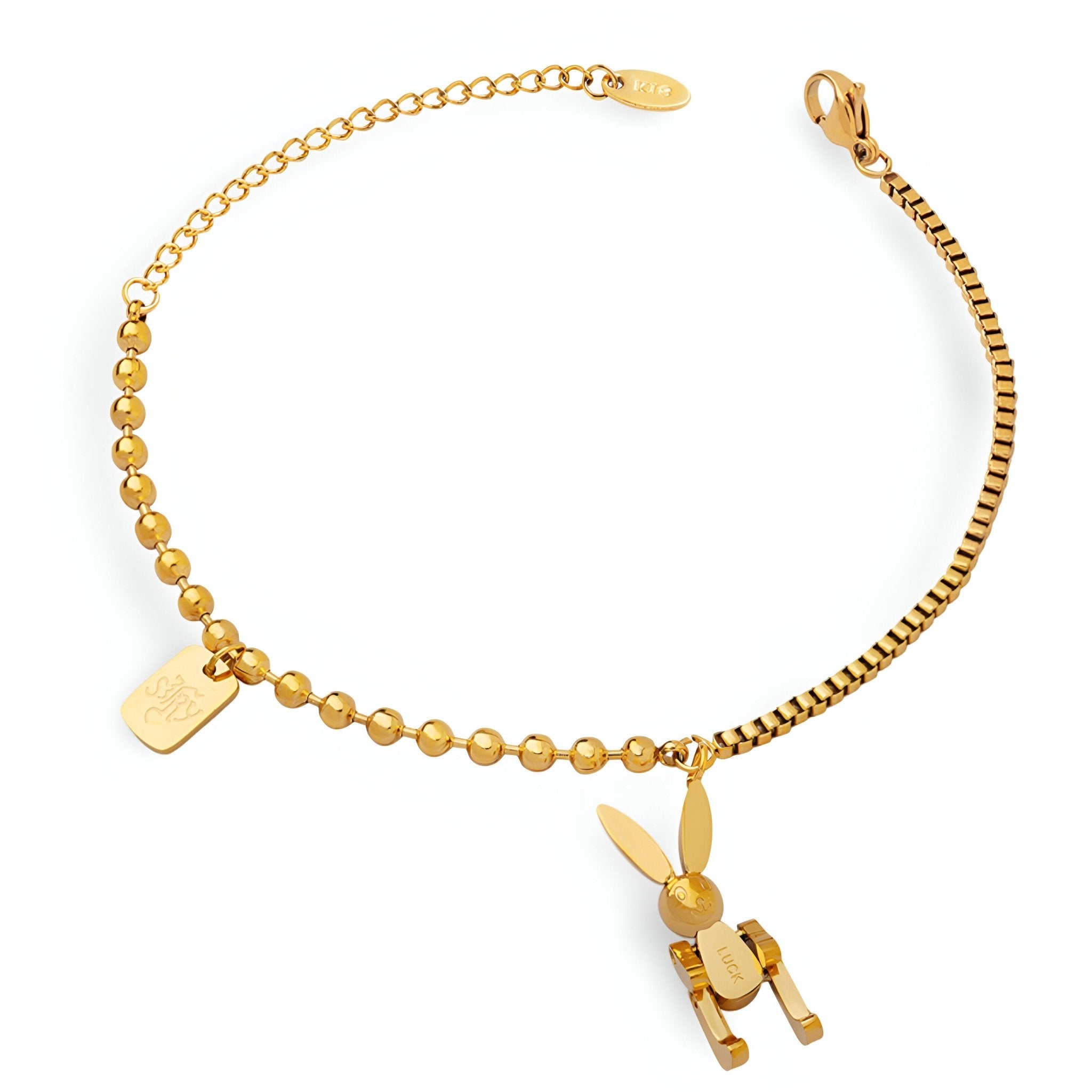 Bracelet doré en titane 18 carats avec perles et pendentif lapin stylisé.