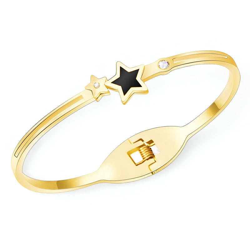 Bracelet jonc doré 18 carats avec étoile noire et petit diamant intégré.