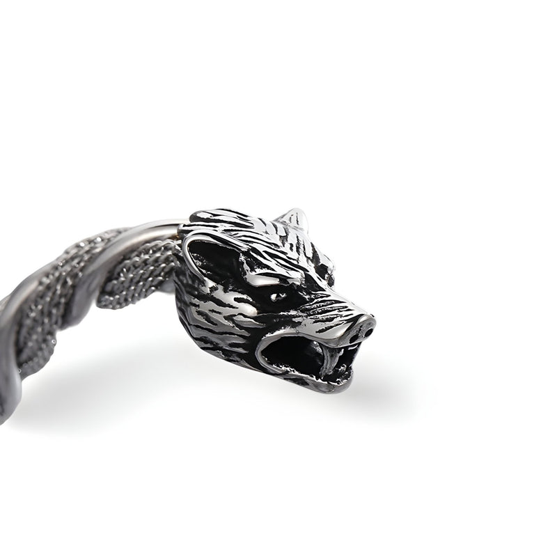 Bracelet jonc argent en acier inoxydable avec double têtes de loup sculptées détaillées.