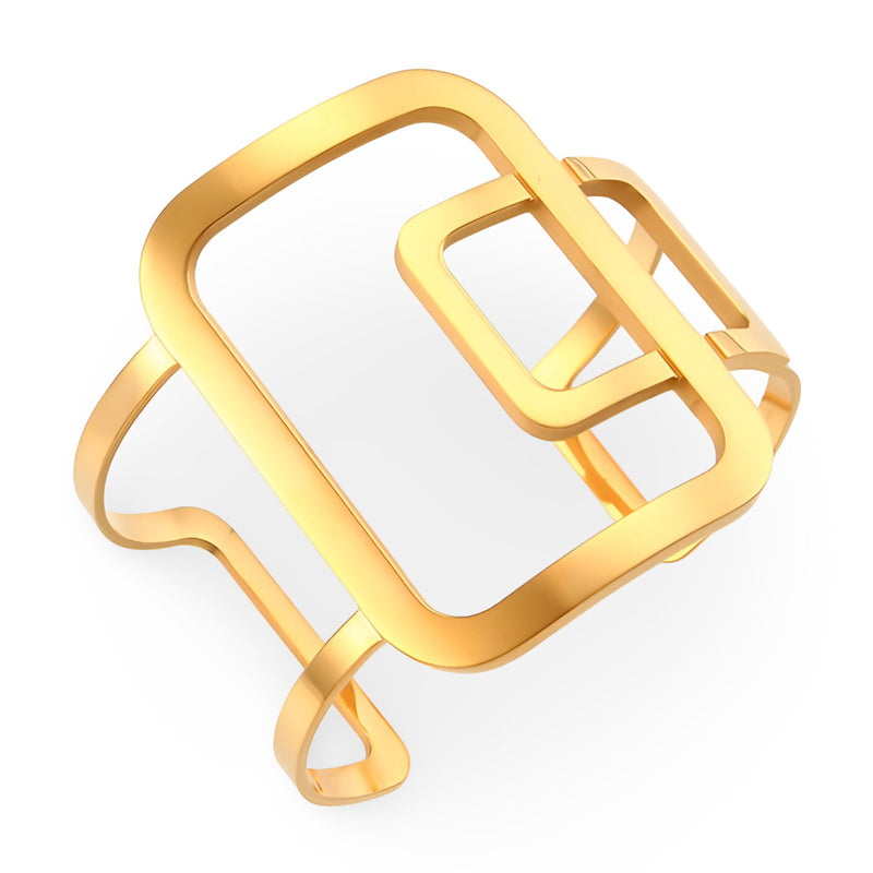 Bracelet manchette en métal doré à design géométrique contemporain avec formes rectangulaires ajourées.