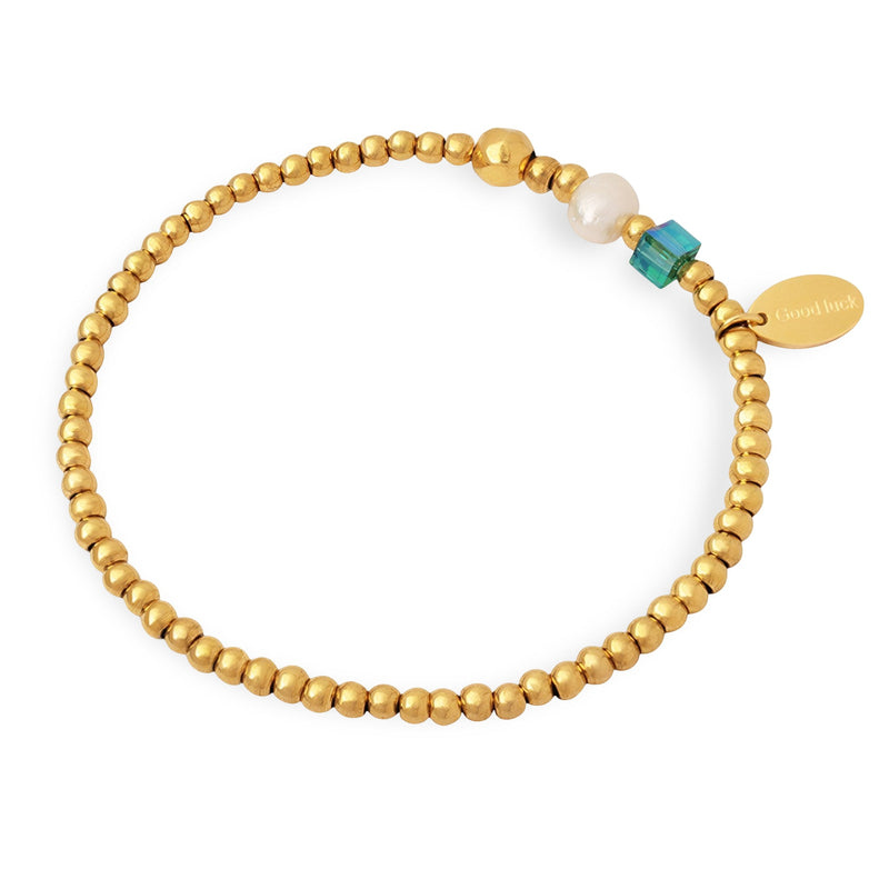 Bracelet fin en perles dorées en titane avec perle d'eau douce blanche et petit cristal turquoise.